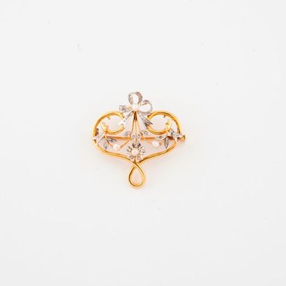 null Broche en filins d'or jaune (750) en forme de coeur à motifs de noeuds et d'entrelacs...