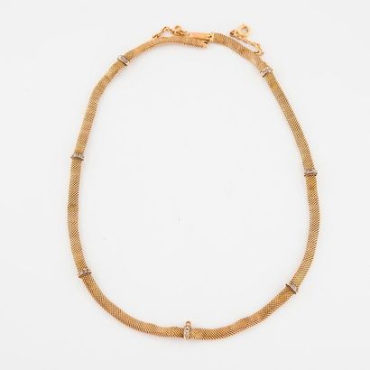 null Necklace in yellow gold (750) with braided mesh, holding seven sliders adorned...