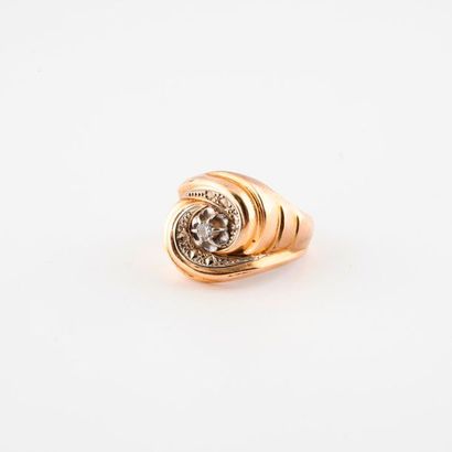 null Yellow gold (750) and platinum (850) tourbillon ring centered on a small brilliant-cut...