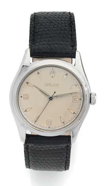 ROLEX Men's steel bracelet watch.
Ivory dial with applied Arabic numerals and arrow...