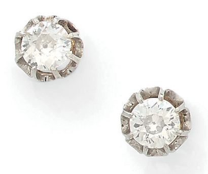 null Pair of yellow and white gold (750) earrings set with antique cut diamonds in...