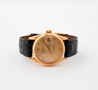 ROLEX ''OYSTER PERPETUAL DATE'' 
Junior model wristwatch in 750 thousandths gold,...