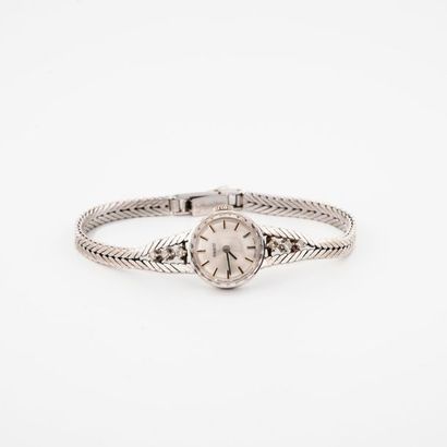 TISSOT 

Ladies' bracelet watch in white gold (585). 

Round housing.

Silvered dial,...
