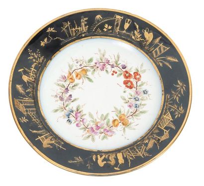 SÈVRES Hard porcelain plate with polychrome decoration in the center of enamelled...