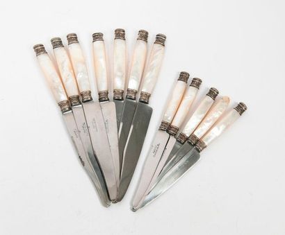 null 
Set of knives with white mother-of-pearl handles and floral and silver gadroons...