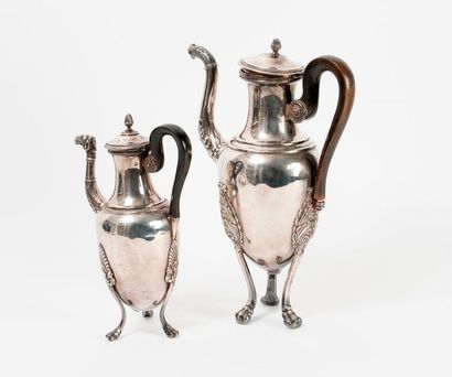 null 
Two tripod baluster coffee pots:

- a small silver one (950) decorated with...