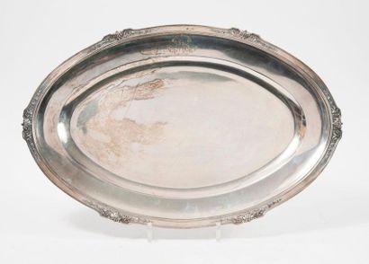 null 
Oval silver dish (950) with contoured edges underlined with six-stapled fillets...