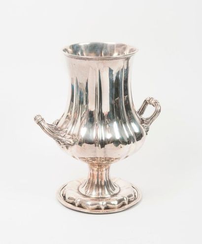 null 
Baluster-shaped vase in silvery metal with two leafy handles and ribbed body...