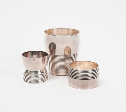 CHRISTOFLE 

Set of silver plated metal objects with grooved decoration comprising...