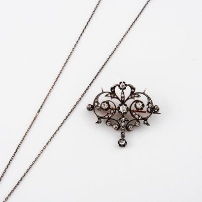 null Openwork brooch pendant in yellow gold (750) and silver (min. 800), centered...