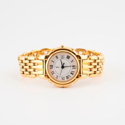 Yves Saint LAURENT 
Montre bracelet de dame en métal doré. 
Boîtier rond. 
Cadran...