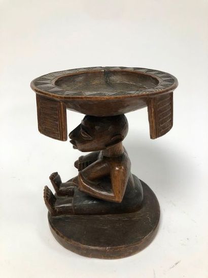 null NIGERIA, Yoruba

Very nice offering cup.

Made of wood, on a circular base representing...