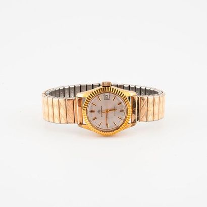BUCHERER 

Ladies bracelet watch in steel and gold metal. 

Round grooved case. 

Dial...