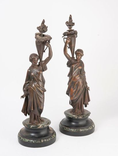 null Pair of bronze bunches of light holders with a shaded brown patina depicting...