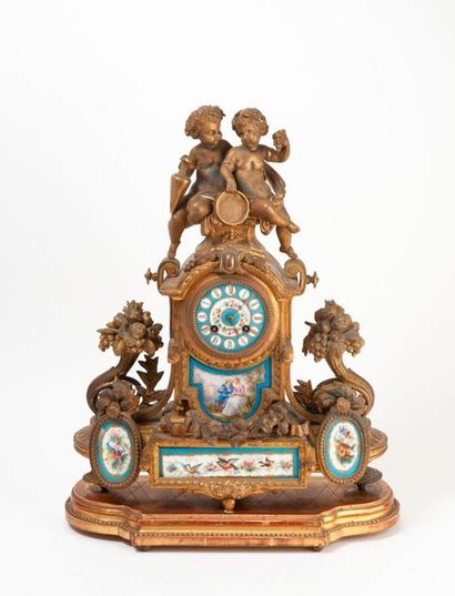 null Bronze and gilded metal mantel clock decorated with porcelain plaques enamelled...