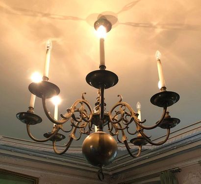 null Patinated brass chandelier with eight winding light arms and central globe.

Electrified.

Holland,...