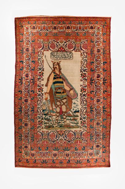 IRAN, XXème siècle 

Polychrome woollen rug with a central motif of a victorious...