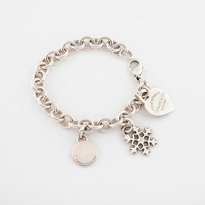 TIFFANY & CO 

Silver bracelet (min.800) with chaton links holding charms including...