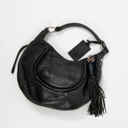 LANCEL 

Black leather bag with one handle worn on the shoulder, zip fastening holding...