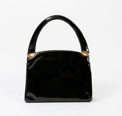 null Black patent leather lady's bag with two handles, hand-carried.

Flap closure,...