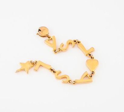 Yves Saint Laurent  
Bracelet articulé en métal doré à maillons en formes de lettres...
