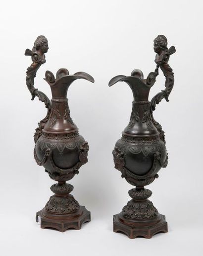 null Pair of large decorative, tapered, bronze pourers with two patinas, in several...