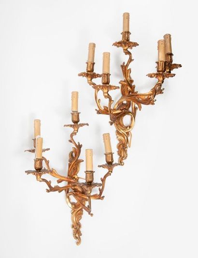 null Pair of five-light sconces in patinated and chiselled brass.

Louis XV style,...