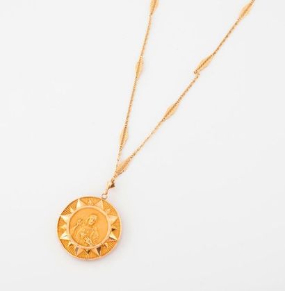 null Yellow gold (750) necklace with fancy openwork links holding a circular yellow...