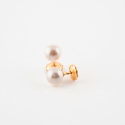 null Pair of yellow gold (750) ear studs with white cultured pearls. 

Total gross...