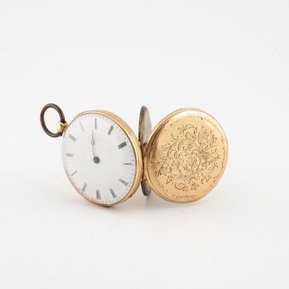 null Gusset watch in yellow gold (750). 
 Back cover with chiselled decoration of...