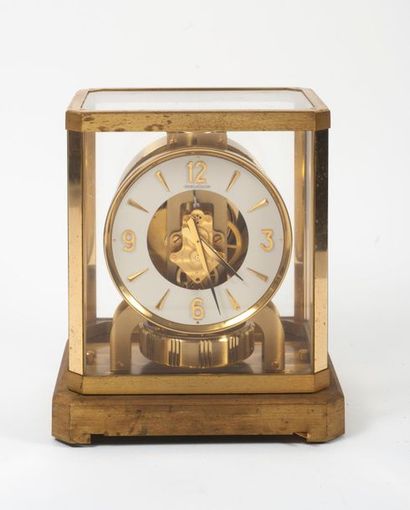 JAEGER-LECOULTRE, Atmos Cage clock in glass and gilded brass in the shape of a bollard.
Cream...