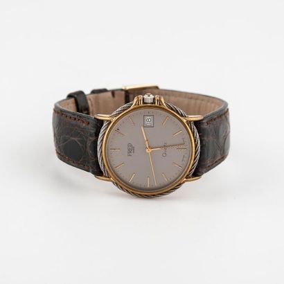 FRED, Force 10 Men's wristwatch in steel and gold-plated metal. 
Circular case decorated...