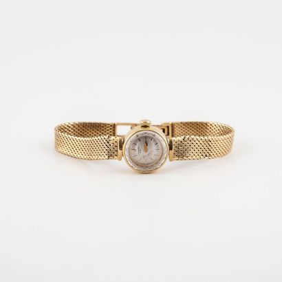 UNIVERSAL GENEVE Montre bracelet de dame en or jaune (750) 
Boîtier rond. 
Cadran...