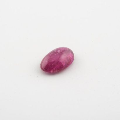 null Tourmaline rubellite in oval cabochon, on paper.
Net weight: 8.6 carats. 
G...