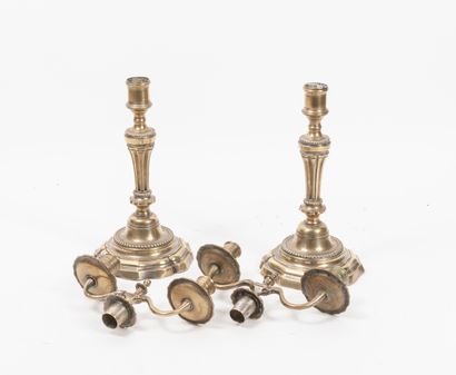 Seconde moitié du XVIIIème siècle Pair of silvered brass torches with wide flutes...