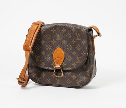 LOUIS VUITTON Sac à main en cuir et toile Monogram. 

Poche intérieure à fermeture...