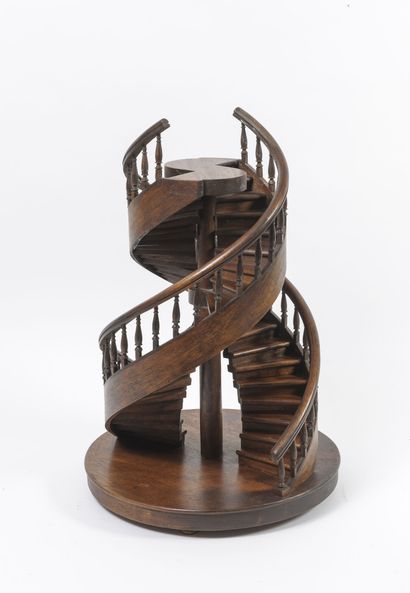 null Stained wood staircase with double revolution and balustrade handrail in the...