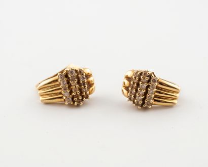 null Pair of yellow gold (750) dormeuses set with three lines of round faceted white...