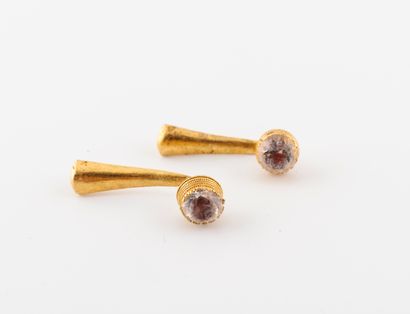  Pair of yellow gold (750) cufflinks set with faceted white stones in a multi-griffle...