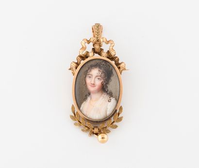  Yellow gold (750) brooch pendant with an oval miniature portrait of a woman with...