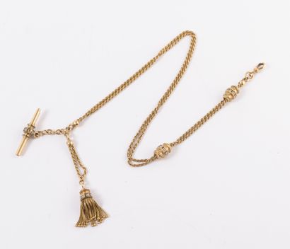  Yellow gold (750) watch chain with twisted link, holding a tassel, key and two sliders...