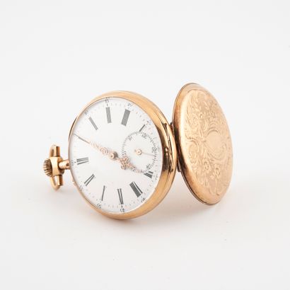 null Yellow gold (750) pocket watch.

Back cover decorated with floral scrolls on...