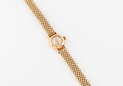 BREITLING Ladies' wristwatch in yellow gold (750). 
Round case. 
Dial with gilt background,...