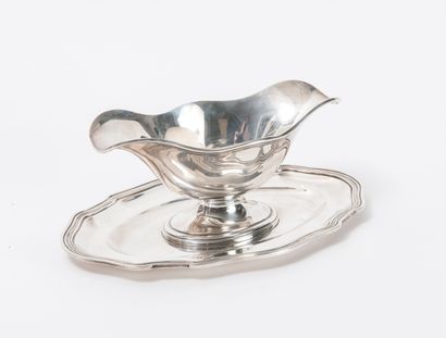 Tétard Frères Sauceboat with two spouts in silver (950) with adherent tray and contoured...