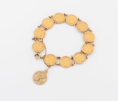 null Yellow gold (750) bracelet made of two gold pesos coins, 1919 and 1920, holding...