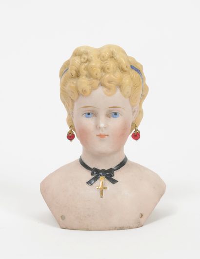 Bust of a porcelain doll with a collar, with...