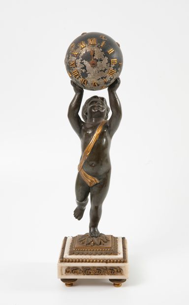 null 
A patinated bronze and gilt bronze clock, representing a putto supporting a...