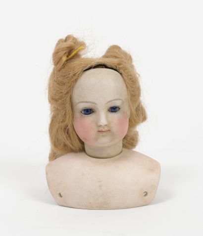 null Two busts of Parisian dolls in porcelain.

- one with swivel head, collar marked...