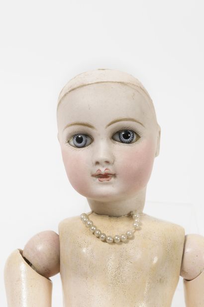 null 
Doll, porcelain head marked in hollow, fixed blue eyes with rays, closed mouth,...