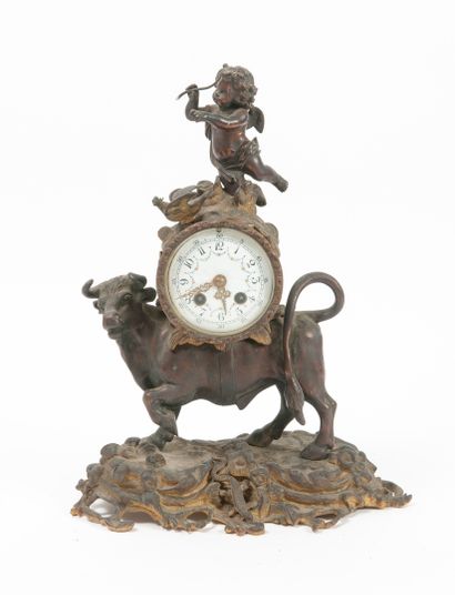 null 
A reddish-brown patinated bronze and gilt bronze clock, featuring Zeus metamorphosed...